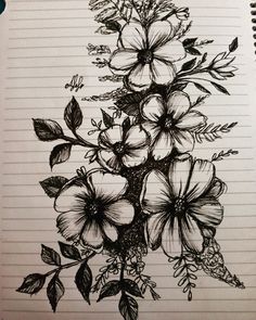 a drawing of flowers on lined paper with pen and ink in the middle, sitting on top of a notebook