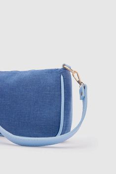 Hey there! Introducing the trendy and fabulous Kate Denim Buckled Denim Baguette Bag from Lunarity Garage! This baguette bag is the ultimate style statement that combines fashion and functionality. Crafted with attention to detail, the Kate Denim Buckled Denim Baguette Bag features a chic denim material that's both stylish and durable. Its denim-on-denim design adds a touch of flair and makes it a must-have accessory for any denim lover. The unique buckle detail adds a hint of sophistication and Trendy Blue Rectangular Baguette Bag, Trendy Blue Baguette Bag For Everyday, Denim Baguette Bag, Denim Chic, Baguette Bag, Denim Material, Denim Design, Style Statement, Hey There