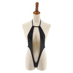 Unleash your daring side with our Daredevil Extreme Micro Thong Monokini Swimsuit. This bold and daring swimwear features a revealing thong design, perfect for your next private pool session. Step up your swim game and make a statement with this seductive swimsuit. This stunning micro monokini is crafted from high-quality Nylon/Spandex, ensuring a soft, stretchy, and comfortable fit. Material: Nylon/Spandex Black T-back Bodysuit For Beach, Black T-back Bodysuit For The Beach, Triangle Top Bodysuit For Club With Lined Body, Triangle Top Bodysuit With Lined Body For Club, Triangle Top Lined Bodysuit For Club, Black Backless Bodysuit With Boning, Party Beachwear String Swimwear, T-back Swimwear For Beach Party, Black T-back Swimwear For Party