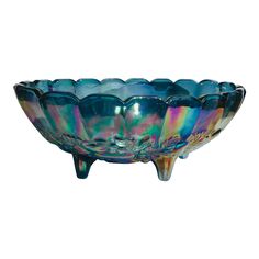 a glass bowl that is sitting on a stand