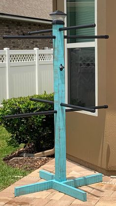 a blue pole with some black bars on it