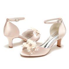 a pair of women's wedding shoes with flowers on the heel and ankle strap