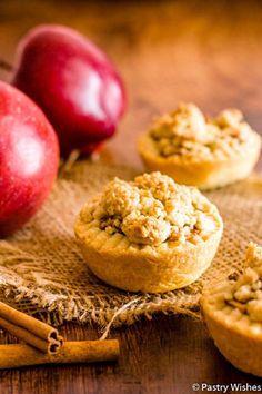 apples and cinnamon rolls on a burlock with cinnamon sticks