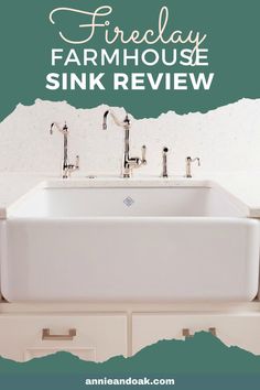 a white sink sitting under a faucet on top of a green and white wall