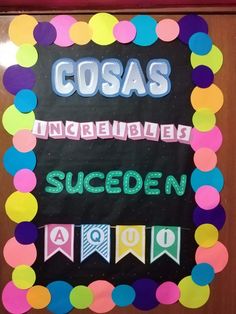 a bulletin board is decorated with colorful paper circles and the words cosas, increible