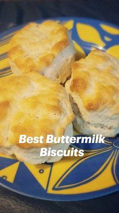 three biscuits on a blue and yellow plate