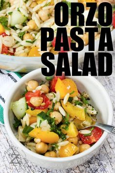 two bowls filled with pasta salad on top of a table