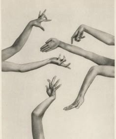 several hands reaching up towards each other in the air with their fingertipss extended out