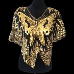 🌟🦋Vintage Silk Butterfly Top Vintage late 70s early 80s gold sequins, 100% silk Butterfly Top. Still has tags. Fits like a M/L and is meant to fit somewhat loose. Please read below for measurements  Measurements  Chest 50" Length 23" Gold Sequin Fabric For Summer Night Out, Gold Embellished Sequin Fabric For Summer, Gold Embellished Tops For Summer, Gold Embellished Summer Top, Glamorous Gold Embellished Top, Glamorous Embellished Gold Tops, Gold Blouse For Summer Parties, Gold Sequin Tops For Spring, Gold Embellished Evening Blouse