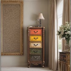 an ornate dresser with three drawers and a lamp on top in front of a window