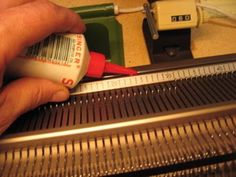 a person is using a thermometer to check their temperature on an escalator