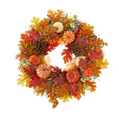 a wreath with autumn leaves and pumpkins