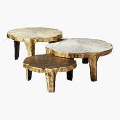 three wooden tables sitting next to each other