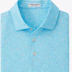 a blue shirt with sail boats on it