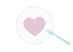 a pink heart on a white plate with a fork