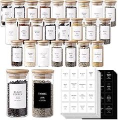 there are many different types of spices in the jars on this display case and labels for each item