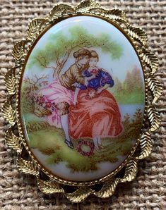 This is a Sweet Cameo of a Courting Couple framed in a beautiful Gold tone Filigree Brooch or also can be used as a pendant on a chain.  Stamped FRAGONARD who was a French artist whose rococo paintings typified the frivolity of life in the royal court of France in the 18th century (1732-1806). Great condition, clasp works well. The Photos are the best source of information.  All questions are encouraged and welcome. Rococo Paintings, Rococo Painting, Victorian Revival, Royal Court, Cute Candy, Heart Brooch, Christmas Candy Cane, Previous Life, Lavender Color