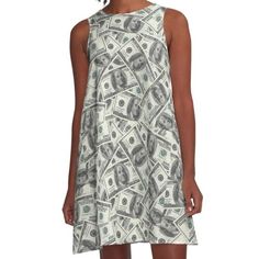 a woman standing in front of a white background wearing a dress made out of money