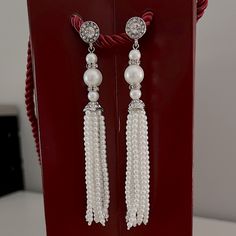 These Are Elegant Faux Pearl Earrings Beautifully Embellished With Rhinestones. They Measure 4” Long And Have Some Weight To Them. They Can Be Worn With Formal Attire Or Can Elevate A Casual Outfit. They Are Brand New. Elegant Silver Tassel Earrings With Dangling Beads, Elegant Silver Beaded Tassel Earrings, Silver Tassel Wedding Earrings, Silver Tassel Earrings With Rhinestones For Wedding, Silver Rhinestone Tassel Earrings For Wedding, Elegant Pearl Drop Tassel Earrings For Party, Elegant Crystal Earrings With Dangling Beads, Elegant Dangle Rhinestone Fringe Jewelry, Elegant Silver Crystal Tassel Earrings