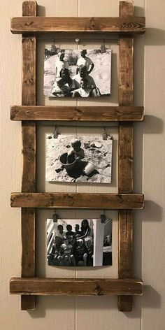 three wooden shelves with pictures hanging on them