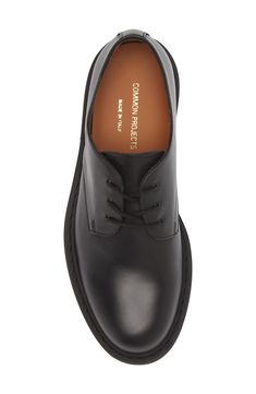 A plain toe enhances the sleek look of an ultrasmooth leather derby crafted in Italy and branded by a foiled logo at the heel. Lace-up style Leather upper and lining/rubber sole Made in Italy Designer Shoes Cap Toe Calf Leather Lace-up Shoes For Work, Black Calf Leather Derby With Plain Toe, Black Calf Leather Derby Shoes With Plain Toe, Black Plain Toe Derby In Calf Leather, Black Plain Toe Calf Leather Derby Shoes, Classic Low-top Dress Shoes For Office, Derby Oxfords With Branded Insole And Calf Leather, Calf Leather Oxfords With Branded Insole For Derby, Calf Leather Oxfords With Rubber Sole For Work