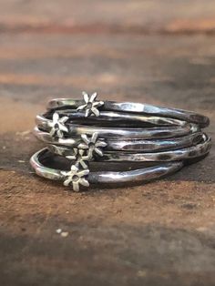 A lovely stack of artisanal star rings make a fun and unique gift for her! or yourself lol. ✨✨ Dainty, Vintage style, sweetheart of ring can be worn as a single or wear as a stack ring with several others! (Adorable either way!) These are cute lil rings! Please check photos for size comparison. They are meant to be dainty.  Made of Sterling silver (925) Christmas gift, Birthday gift, Boho gift, hippie gift for those you love! Handmade, as is all of the jewelry in my store. Artisanal, Bohemian st Silver Star Ring, Bohemian Vintage Style, Hand Engraved Rings, Hippie Rings, Hammered Silver Ring, Sterling Silver Stacking Rings, Hippy Gifts, Stack Ring, Ring Stack