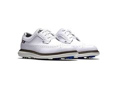 FootJoy Traditions - Men's Shoes : White/Navy/Grey : Crafted from a full-grain leather this FootJoy Traditions golf footwear provides you with an all day style and comfort while you're out with the boys showing off your skills on the golf course! Leather upper and lining. Lace closure. Round-toe silhouette. Textile insole. EVA Fit-Bed ensures all-day underfoot comfort. Foam midsole provides lightweight comfort. Synthetic outsole with Fast Twist 3.0 cleat system with Pulsar spikes. Imported. Meas Functional Golf Shoes With Branded Insole, Leather Golf Shoes, Sporty Style, Leather Sporty Golf Shoes, Sports Golf Shoes With Rubber Sole, Golf Sneakers With Rubber Sole And Round Toe, Classic White Golf Sneakers, Classic Leather Golf Shoes, Sporty Golf Shoes With Textured Sole And Round Toe, Sporty Golf Shoes With Textured Sole