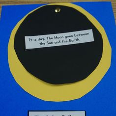 a blue and yellow card with a quote on it that says, it is day the moon goes between this sun and the earth