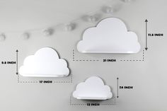 two white clouds are hanging on the wall next to each other with measurements for each cloud