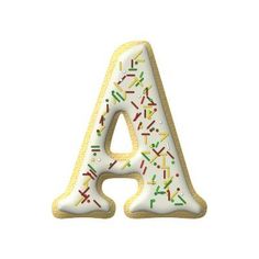 a cookie shaped letter with sprinkles on it