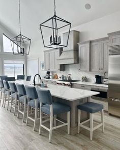 a kitchen filled with lots of counter top space next to a refrigerator freezer and oven