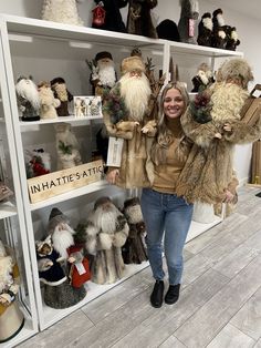 a woman standing in front of a shelf filled with stuffed animals and other stuff items