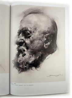 an old man's face is shown in the book, which has been opened to reveal