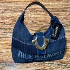 True Religion Bag Blue Denim Hobo Shoulder Bag Brand: True Religion Size: 16” X 9” X 4.5” Approx Color: Blue Denim Condition: Brand New With Original Tags Same Day Shipping Via Usps Designer Blue Bags With Logo Hardware, Casual Shoulder Bag With Logo Hardware For Everyday Use, Casual Tote Bag With Logo Hardware, Casual Rectangular Shoulder Bag With Logo Hardware, Blue Denim Bag With Dust Bag Included, Casual Rectangular Bags With Logo Hardware, Casual Rectangular Bag With Logo Hardware, Blue Denim Bag With Branded Hardware, Blue Denim Shoulder Bag With Branded Hardware