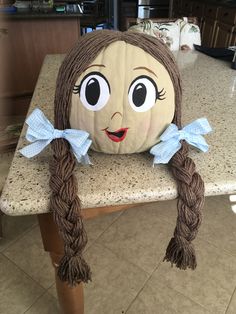 a large pumpkin sitting on top of a table