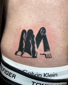 a person with a knife and fork tattoo on their stomach that says, calvin klien