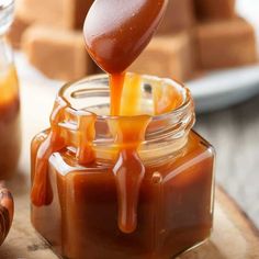 two ingredient caramel sauce is being poured into a jar