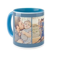 a blue and white coffee mug with an image of a man holding a baby in his arms