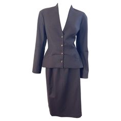 New with tags early 90s THIERRY MUGLER brown wool and cashmere skirt suit ! The perfect brown color that is a great alternative to black. Tailored jacket snaps up the front, with pockets at each side of the waist. High waisted pencil skirt has hidden zipper up the back with hook-and-eye closure. New with original store tags attached. Only two small holes on front of skirt that is covered by the jacket. Brown lining prevents any skin showing. Made in France Marked Size 42 Measurements: Jacket 38 Lana Vintage, Cashmere Skirt, 90s Skirt, Brown Line, 1990s Fashion, High Waisted Pencil Skirt, Thierry Mugler, Early 90s, Tailored Jacket