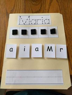 a piece of paper that has the word march spelled out with magnets on it