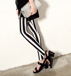 Conquer the world in these bold Black and White Thick Vertical Stripes Leggings Pants! Featuring a sleek design and eye-catching stripes, these pants are perfect for those who love to take risks and embrace their adventurous side. These leggings will definitely elevate your style and confidence, making you stand out from the crowd. Activewear Trends, Printed Yoga Leggings, Hip Style, Leggings Outfit, Swimwear Trends, Boho Summer Dresses, Sweater Trends, Stretchy Leggings, Urban Street Style