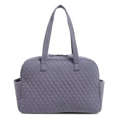 Let us help you bring back the glamorous age of travel with this mid-size travel bag. Thoughtful design makes travel a pleasure from the plentiful pockets (inside and out) to the comfortable handles to the trolley sleeve. Outlet Exclusive Exterior features a zip pocket and two slip pockets Trolley sleeve Interior features a mesh slip pocket Zip closure. Dimensions: 18. 0" w x 12. 0" h x 7. 0" d Handle/Strap Strap drop 12. 0" Weight: 1. 18 lb Vera Bradley Outlet Medium Traveler Bag in Carbon Gray Travel Satchel Diaper Bag With Zipper Pocket, Weekender Satchel Bag With Pockets For On-the-go, Travel Tote Diaper Bag With Pockets, Travel Diaper Satchel With Zipper Pocket, Travel Diaper Bag Satchel With Zipper Pocket, On-the-go Weekender Shoulder Bag With Pockets, Travel Diaper Bag Tote With Pockets, Travel Diaper Bag With Pockets Tote Shape, Satchel Weekender Bag With Pockets