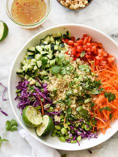 a white bowl filled with different types of vegetables