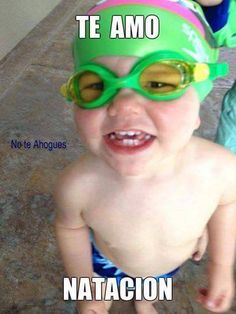 a baby wearing swimming goggles with captioning that says te amo natacon