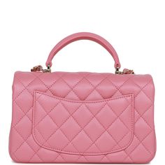 This Mini Rectangular flap bag is in dark pink lambskin with light gold tone hardware and has a front flap with signature CC turnlock closure, rear half moon pocket, top handle and single interwoven dark pink leather and light gold tone chain link shoulder/crossbody strap. The interior is lined in dark pink leather and features a zipper pocket with Chanel pull and an open pocket below. Collection: 22A Origin: Italy Condition: Pristine; new or never Accompanied by: Chanel box, Chanel dustbag, felt, carebook and ribbon Measurements: 8.5" width x 6" height x 3" depth; 1.77" top handle, 22.5" strap drop Chanel Mini Rectangular, Chanel Box, Chanel Mini, Pocket Top, Vuitton Bag, Flap Bag, Pink Leather, Brunei, Lambskin Leather