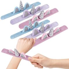 PRICES MAY VARY. SLAP TO WRAP: A blast from the past with an adorable twist! These unicorn slap bracelets are the perfect treats for kids of all ages. Every set comes with 12 pieces, thoughtfully sized to fit most wrists. Dish them out and watch all those cuties beam in glee. RAINBOW OF COLOR: Inspired by all things cute and magical, these unicorn bracelets stand out with lovely shades of pink, purple, and blue. Unicorn lovers will relish the 3D horn and ear design that brightens any day with lo Bracelets For Kids, Dragon Birthday Parties, Unicorn Bracelet, Plush Unicorn, Kids Carnival, 5th Birthday Party Ideas, Girls Party Favors, Unicorn Party Favors, Dragon Birthday