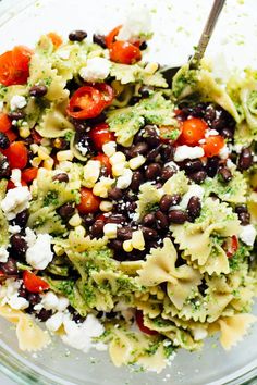 a bowl filled with black beans, broccoli and fettuccine salad