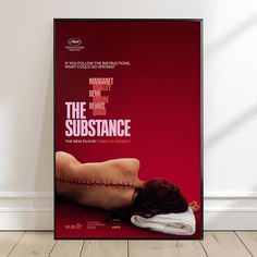 a movie poster with the words the substance on it's back and an image of a woman laying down