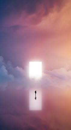 a person standing in the middle of a cloud filled sky with an open square above them