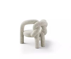 a chair made out of concrete with a knot around it